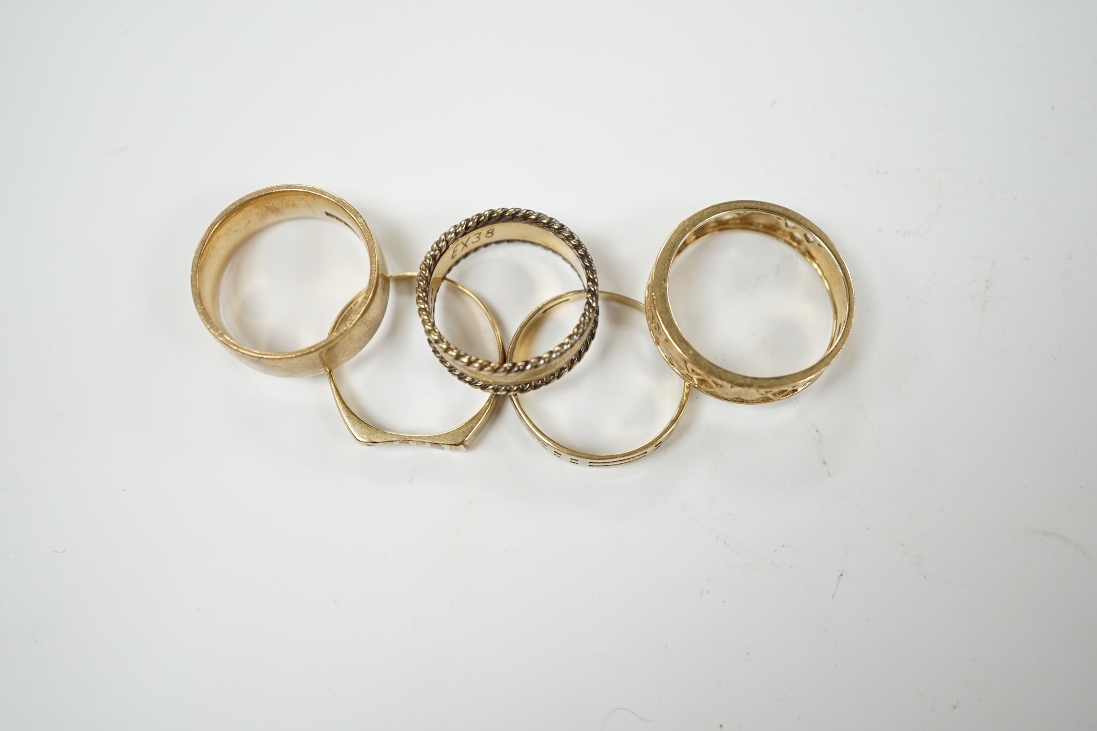 Five assorted 9ct gold bands, including two pierced, various sizes, 17.9 grams. Condition - poor to fair